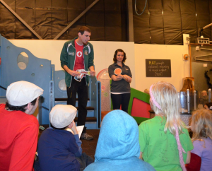 Ari and Emily teach young museum-goers about fire safety. 